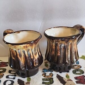 Set Of Two Brown and Cream Ceramic Mugs.